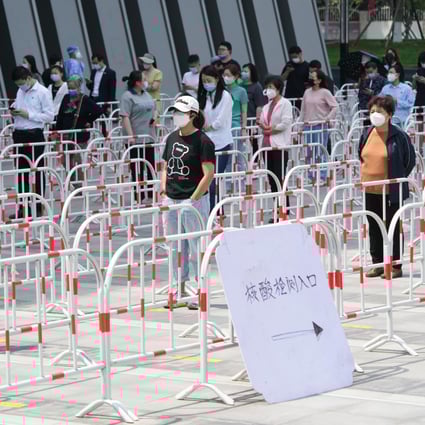 People line up to take a nucleic acid test in Chaoyang district in Beijing. Photo: Xinhua