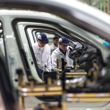 Employees work on the Honda Civic production line at a factory in Wuhan that the Japanese carmaker operates as a joint venture with China’s Dongfeng Motor Group. Japanese manufacturers are increasingly looking to move offshore operations back home, according to reports. Photo: AFP