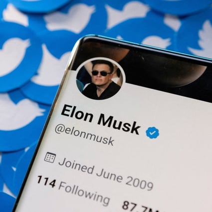 Elon Musk’s Twitter profile seen on a smartphone placed on printed Twitter logos in this picture illustration taken April 28. Photo: Reuters