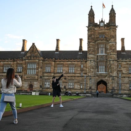 Chinese students at the University of Sydney take photos on the campus on August 20, 2020.  Photo: Reuters