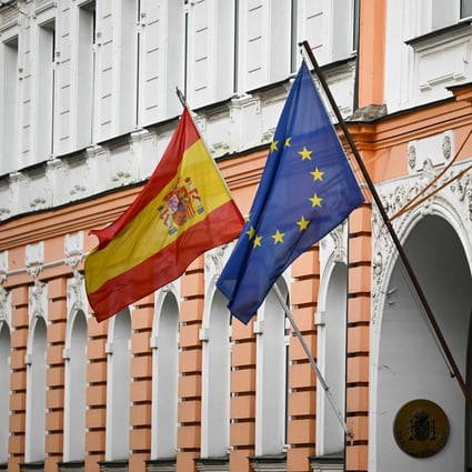 Flags of Spain and the European Union fly outside the Spanish embassy in Moscow. Photo: AFP