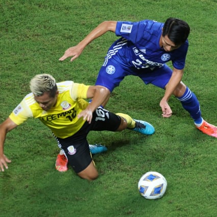 Lee Man’s Ngan Lok-fung (left) battles for the ball with Eastern Long Lions’ Wong Wai during their AFC Cup Group J match at Hong Kong Stadium on June 23, 2021. Photo: K. Y. Cheng