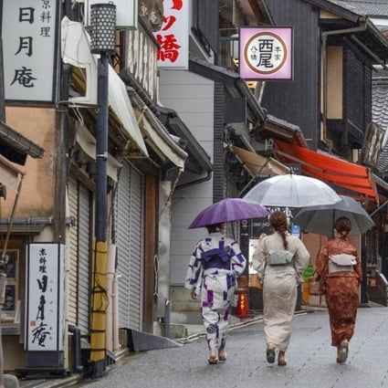 People walk near Kiyomizu temple in Kyoto, Japan. Japan will relax its Covid border restrictions from June 1, including by doubling its daily cap on the number of international arrivals allowed to 20,000. Photo: Kyodo via Getty Images