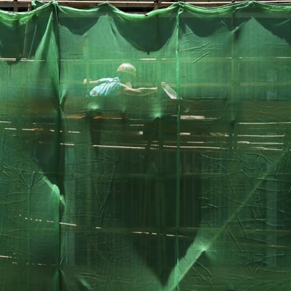 A construction worker toils in the sun at Allegro property development in Kowloon City on May 19, 2022. Photo:  Jonathan Wong