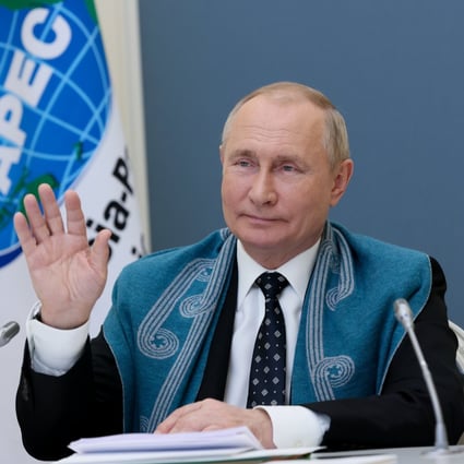 Russian President Vladimir Putin waves as he takes part in an Asia-Pacific Economic Cooperation summit via video link last year. Photo: Reuters