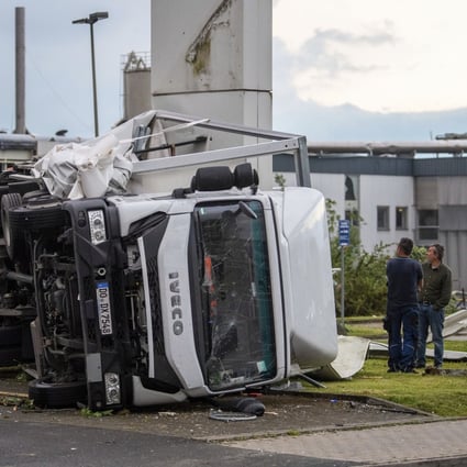 Two trucks were overturned by the storm in Paderborn, Germany on Friday. Photo: dpa via AP