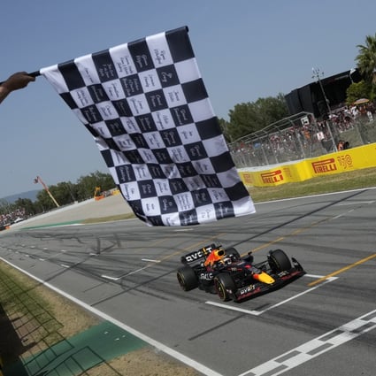 Red Bull driver Max Verstappen of the Netherlands takes the chequered flag as he wins the Spanish Grand Prix. Photo: AP