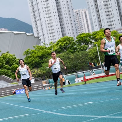 Leung San-lok wins the 200 metres in 21.63 seconds with Ng Ka-fung (right) in third place. Photo: HKAAA