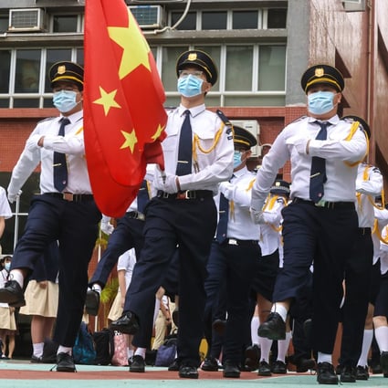 A flag-raising ceremony at Gertrude Simon Lutheran College in Yuen Long on National Security Education Day on April 15, 2021. Photo: K. Y. Cheng