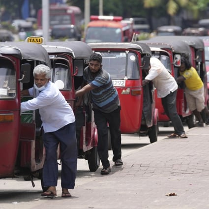 Sri Lankan auto rickshaw drivers queue up to buy petrol in Colombo on April 13. The country’s financial crisis has become so severe it cannot import food or gasoline. Photo: AP