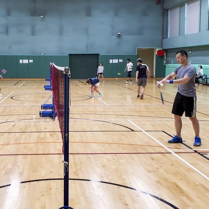 People play badminton at Fa Yuen Street Sports Centre. Photo: Edmond So