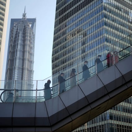 People enter an office in Lujiazui, mainland China’s largest financial district, in Shanghai, on February 24. Photo: Reuters