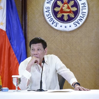 Philippine President Rodrigo Duterte listens during a meeting with government officials in Manila on Monday. Photo: King Rodriguez/ Malacanang Presidential Photographers Division via AP