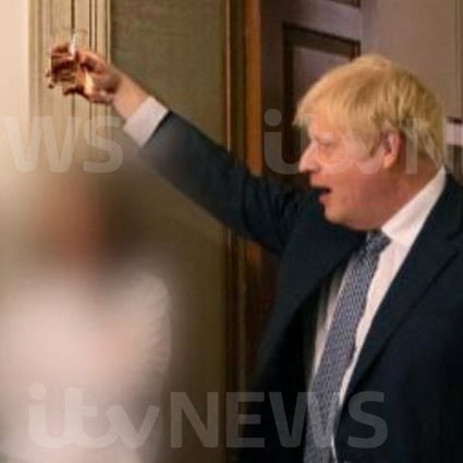 British Prime Minister Boris Johnson raises a glass during a party at Downing Street in an image said to be taken in November 2020, amid the coronavirus pandemic. Photo:  ITV News via Reuters