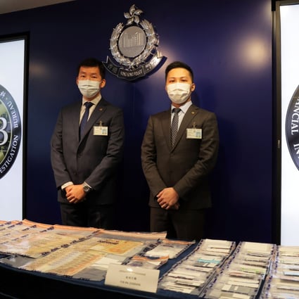Chief Inspector Cheng Sze-wai and Senior Inspector Chan Hok-lun at a press conference displaying the evidence. Photo: Jelly Tse
