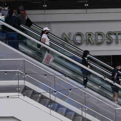 People shop at the Nordstrom Local DTLA in downtown Los Angeles on March 15. Some economists point to the decline in consumer confidence, to levels not seen in years, as evidence that higher prices are taking their toll. Photo: AP