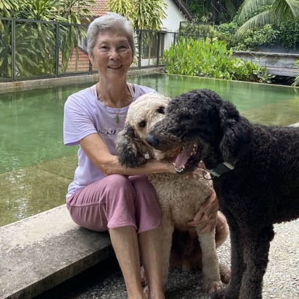 Marguerite Brodie with her dogs Kermit and Moe in Kuala Lumpur. Thanks to decades of dancing and tennis, Rolfing and daily Dharma practice, she stays fit and healthy. Photo: Lise Floris