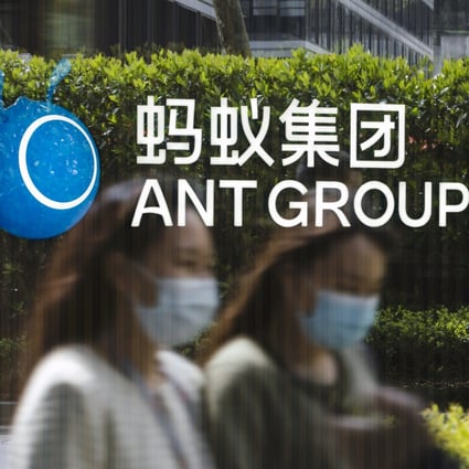 Employees walk past a logo at the Ant Group headquarters in Hangzhou, China. Photo: Bloomberg