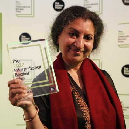Author Geetanjali Shree poses with the 2022 International Booker Prize award for her novel ‘Tomb of Sand’ in London. Photo: AP 