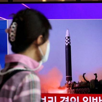 A woman in Seoul on Wednesday watches a news report on North Korea’s launch of three missiles, including one thought to be an intercontinental ballistic missile. Photo: Reuters