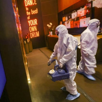 Cleaners disinfect Zentral in California Tower in Lan Kwai Fong. Photo: Dickson Lee