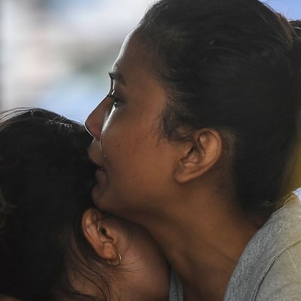 Relatives of passengers on board a missing aircraft in Nepal wait for news. Photo: AFP