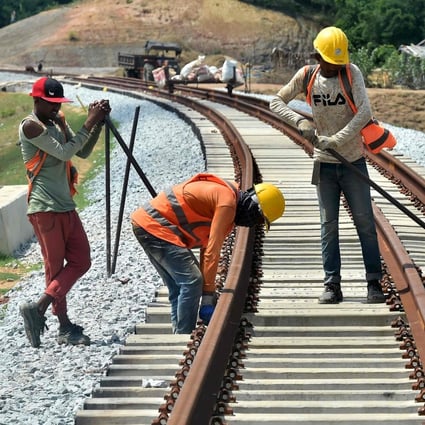 Workers adjusts fasteners during construction of the Chittagong-Cox’s Bazar railway line in Ramu, Bangladesh, on May 17. Photo: AFP