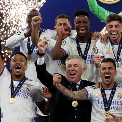 Real Madrid coach Carlo Ancelotti celebrates with his players after winning the Champions League at Stade de France. Photo: Reuters