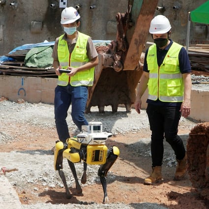 A robot dog is used on a construction site to an run autonomous survey. Robots are helping with a manpower shortage in Singapore. Photo: Reuters