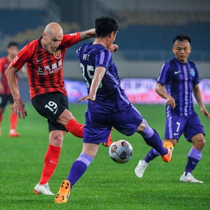 Aaron Mooy (left) may be missing when Shanghai Port begin the delayed Chinese Super League season. Photo: Xinhua