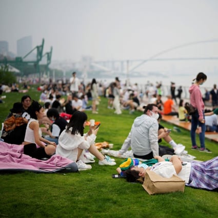People spend time at a riverside park in Shanghai on Wednesday after the city’s long Covid-19 lockdown was lifted. Photo: Reuters