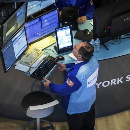 A trader is seen at work on the New York Stock Exchange on June 1. Stock markets have been doing a poor job in directing savings into long-term investment. Photo: New York Stock Exchange via AP