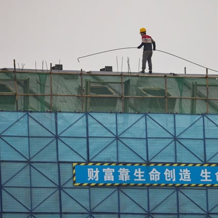 A construction site in Beijing. Developers’ contracted sales have stopped falling further from March and April, according to one of the largest real estate brokers in China. Photo: Reuters
