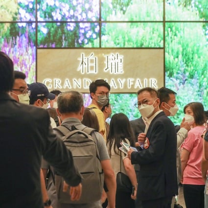 Potential buyers wait in line to buy flats at Sino Land’s Grand Mayfair residential development in Yuen Long, on May 20, 2022. Photo: Xiaomei Chen