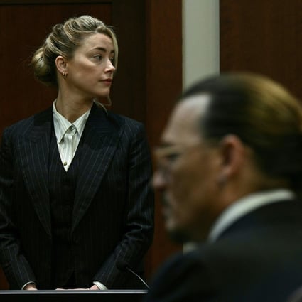 Amber Heard and Johnny Depp watch as the jury comes into the courtroom after a lunch break at the Fairfax county circuit courthouse in Virginia on May 17. Photo: AFP 