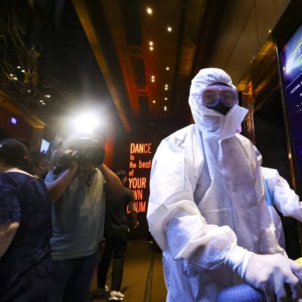 Cleaners disinfect Zentral club in the California Tower in Hong Kong’s Lan Kwai Fong area, following an outbreak of Covid-19 cases. Photo: Dickson Lee