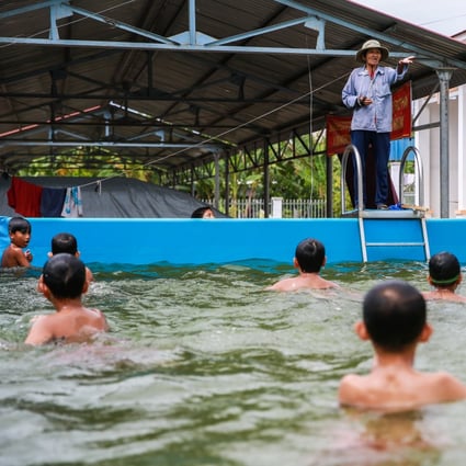 Sau Thia teaches children swimming in a makeshift pool in Vietnam’s Dong Thap province. Photo: Giang Pham
