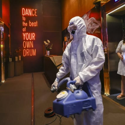 Cleaners disinfect Zentral nightclub in Lan Kwai Fong. Photo: Dickson Lee
