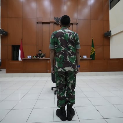 Colonel Priyanto stands in a courtroom during his trial at the military court in Jakarta, Indonesia. Photo: AP