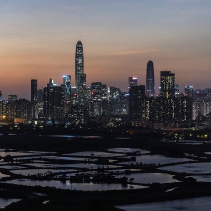 The Shenzhen skyline seen at dusk from the Lok Ma Chau area in Hong Kong. The southern Chinese tech hub wants to become a powerhouse in semiconductors. Photo: Bloomberg