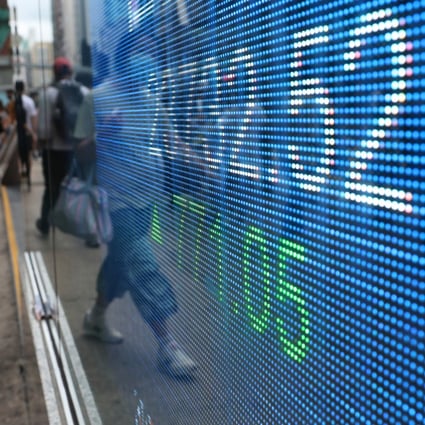 An electronic board showing the Hang Seng Index outside a bank in Mong Kok, Hong Kong. Photo: Edmond So