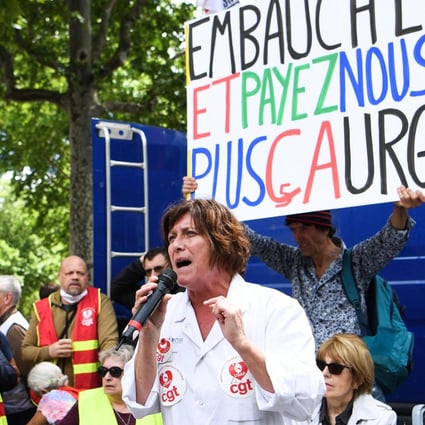 A demonstration to support French hospital staff members is seen in front of the ministry of Health in Paris on Tuesday. Photo: AFP