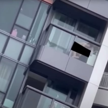 A woman has been arrested after a video of a couple having sex in broad daylight on the balcony of a flat was posted online. Photo: Facebook
