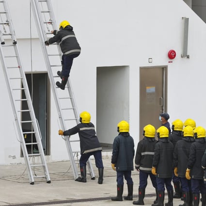 Firefighters during a training exercise at the Fire and Ambulance Services Academy in Tseung Kwan O. Photo:  Edmond So