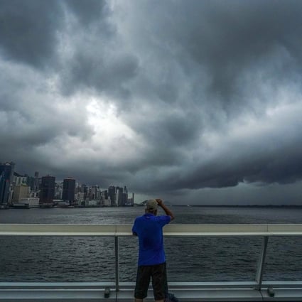 Dark clouds hang over Hong Kong’s famed Victoria Harbour.  Photo: Felix Wong