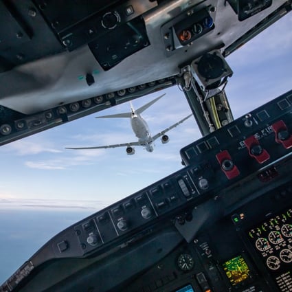 A P-8A maritime patrol aircraft of the type Australia said was intercepted in ‘international airspace’ over the South China Sea is seen from the cockpit of another plane. Photo: SAC James Skerrett/British Ministry of Defence Handout via EPA-EFE