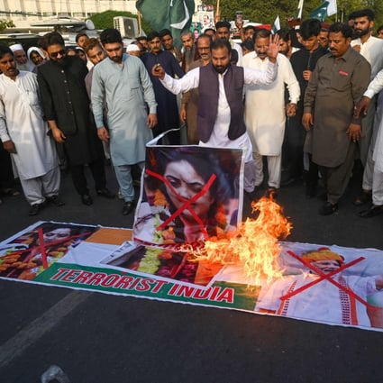 Pakistani protesters burn a poster of BJP’s Nupur Sharma in Karachi on June 7. Photo: AFP
