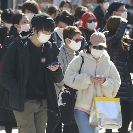 When the coronavirus pandemic began over two years ago, people in Japan quickly donned masks en masse with little complaint. But now the government has relaxed its guidance on outdoor mask usage, the message appears not to be filtering through. Photo: AP