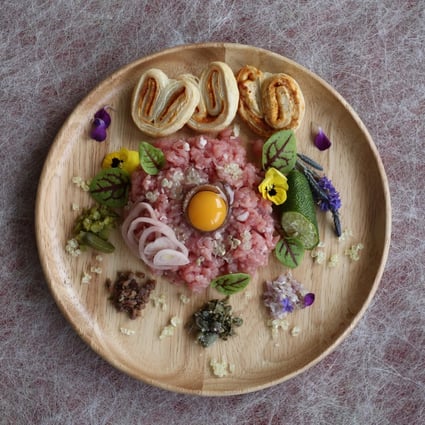 Veal tartare with pickled shallots, Parmesan paprika palmiers and finger limes: light, lean and elegant. Photo: Jonathan Wong