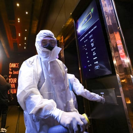Cleaners disinfect a nightclub in Lan Kwai Fong following an outbreak of Covid-19 on May 28. Photo: Dickson Lee